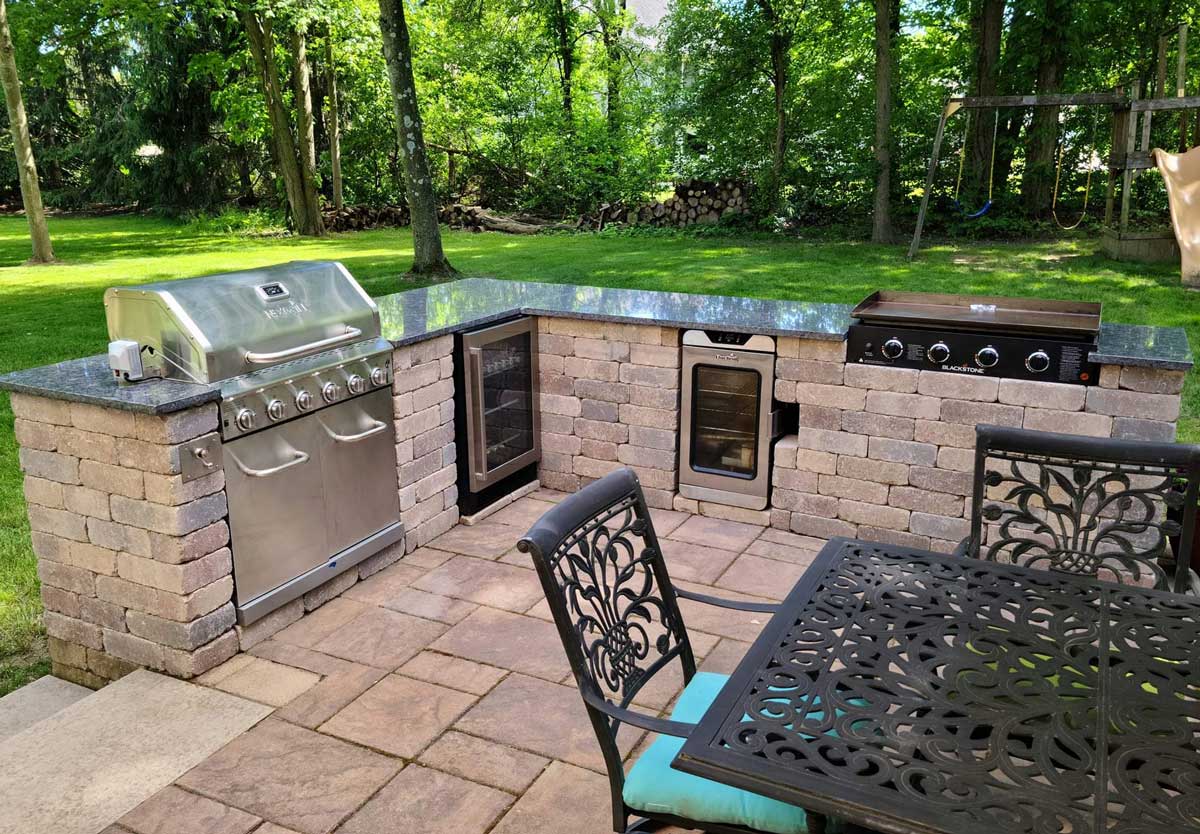 outdoor grill and entertainment area with wine cooler