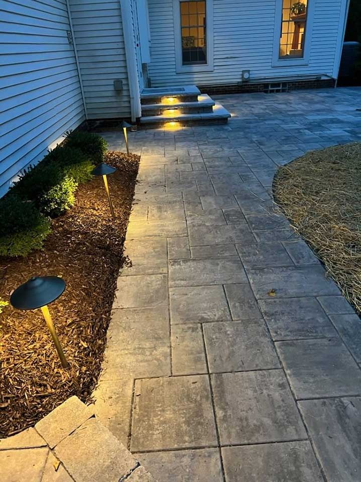 low voltage lighting along a path to a house