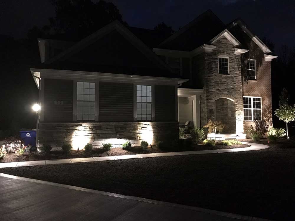 low voltage up lighting against a house